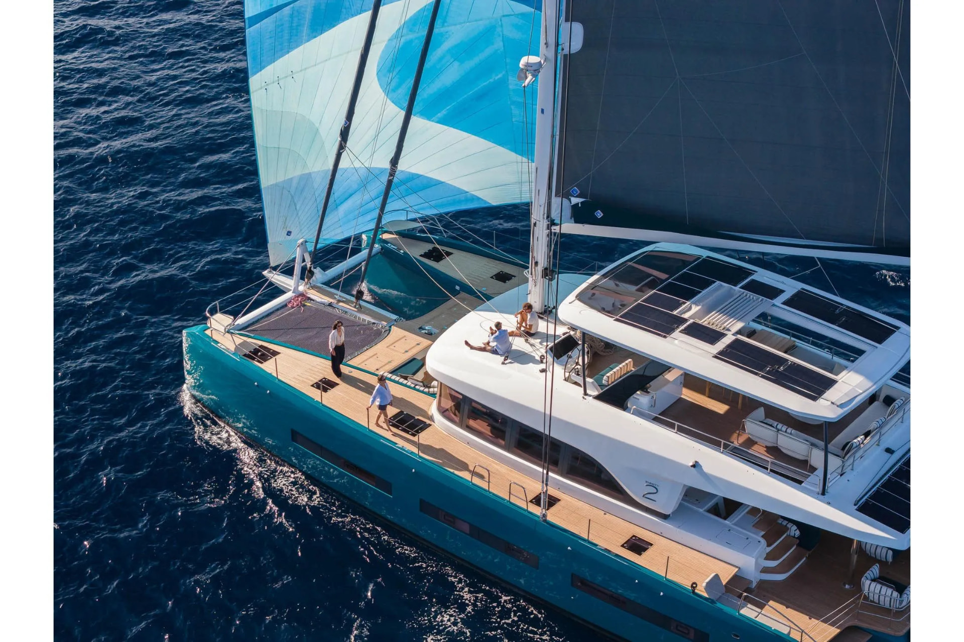 Aerial view of the Lagoon Eigthy2 catamaran under sail on deep blue water